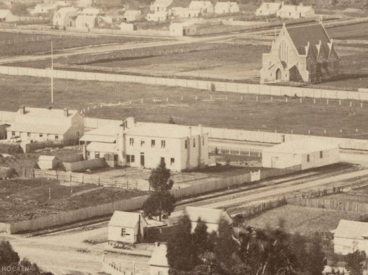 Detail from a late 1860s photograph showing the building from the rear (at centre). All Saints' Church is also prominent. Ref: Hocken Photographs Album 073.